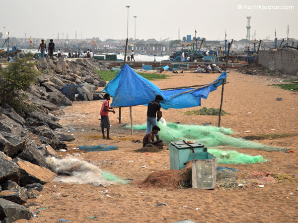 Fishing nets are being repaired for the next adventure into the sea.